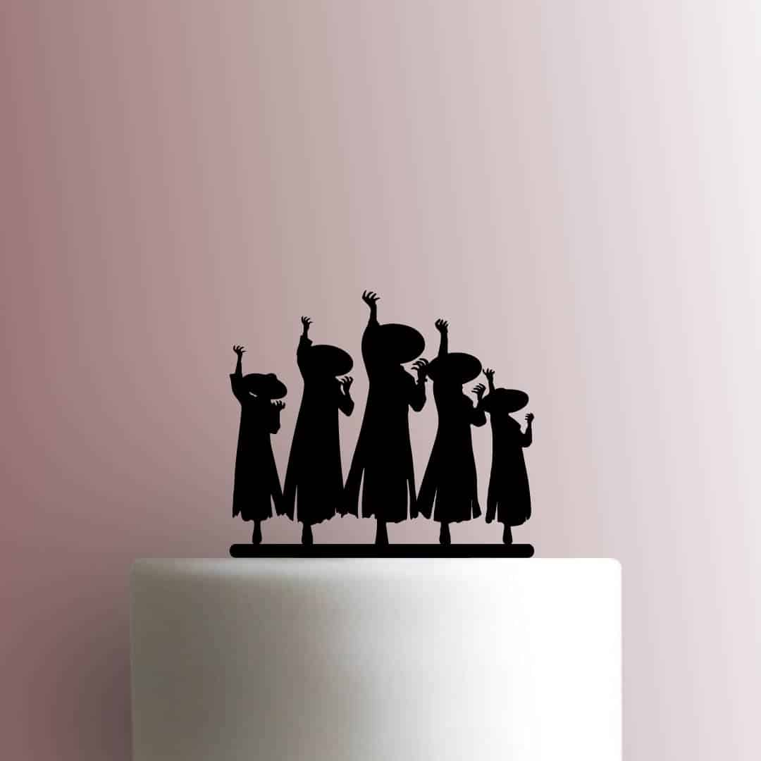 Silhouette cake topper of five people on a white cake against a pink background